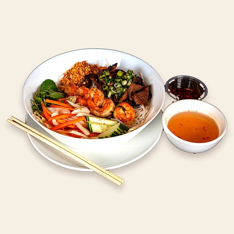 Vermicelli salad with grilled pork, shrimp and peanuts, with fish sauce on the side