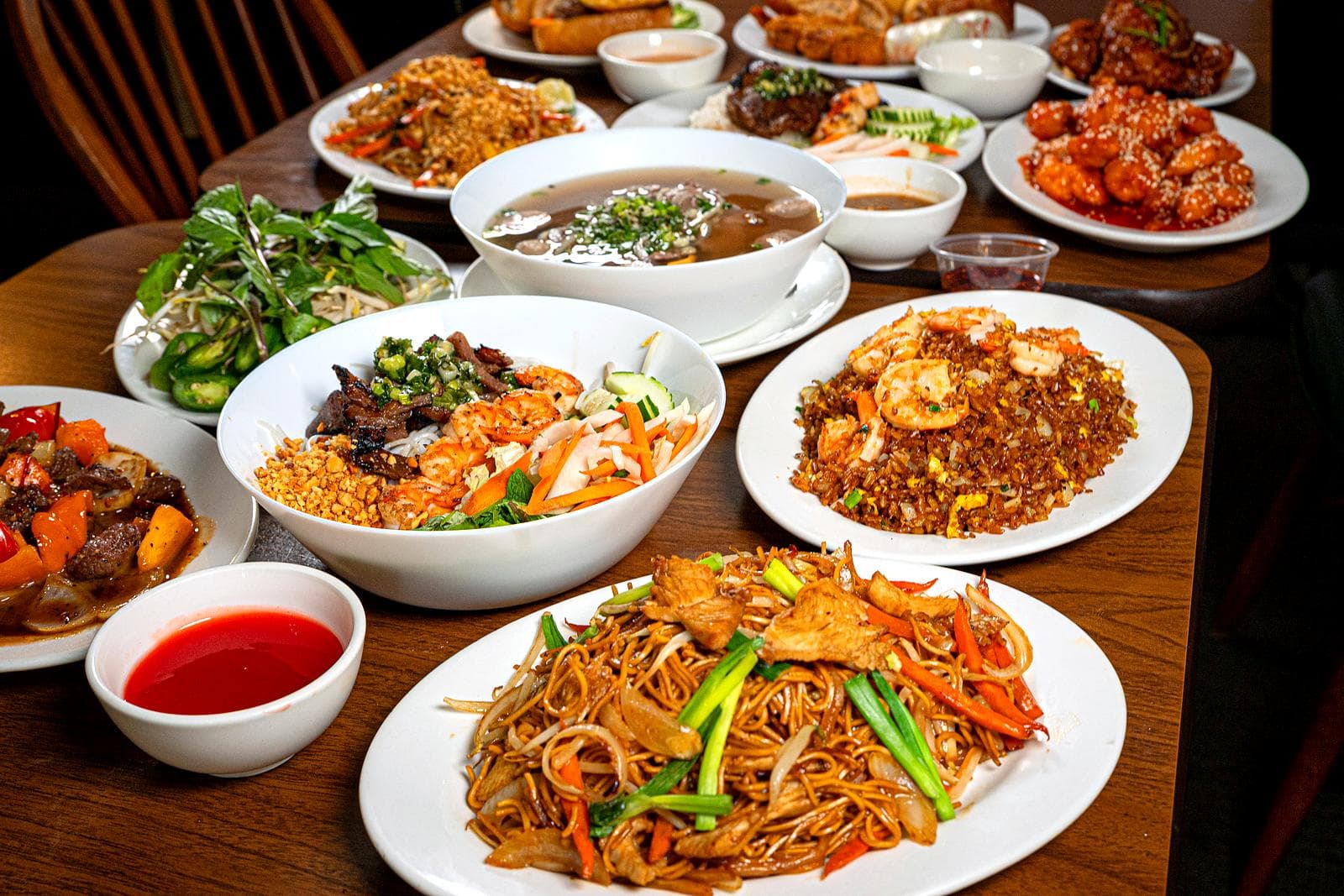 Phở, vermicelli salad, shrimp fried rice, lo mein and more dishes from Saigon Palace on one table